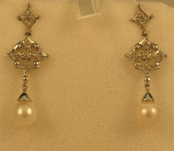 Appraisal: PAIR OF PEARL DIAMOND AND FOURTEEN KARAT WHITE GOLD EARRINGS