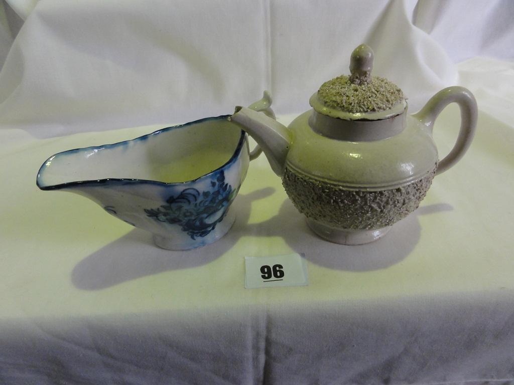 Appraisal: A late th century sauce boat with blue and white