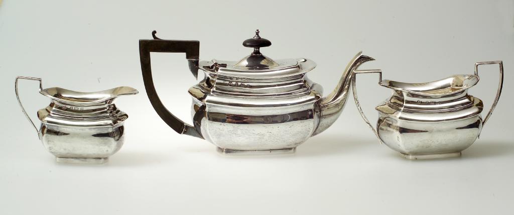 Appraisal: EDWARDIAN SILVER THREE-PIECE TEA SERVICE BIRMINGHAM AND LATER comprising teapot