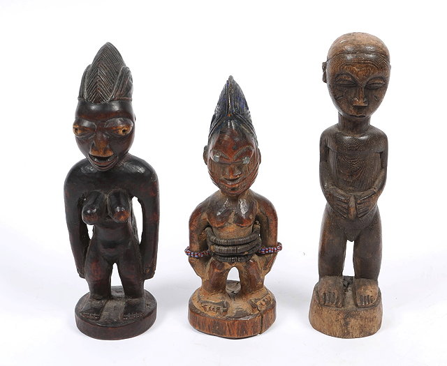 Appraisal: A YORUBA TRIBAL FEMALE FIGURE with carved head dress on