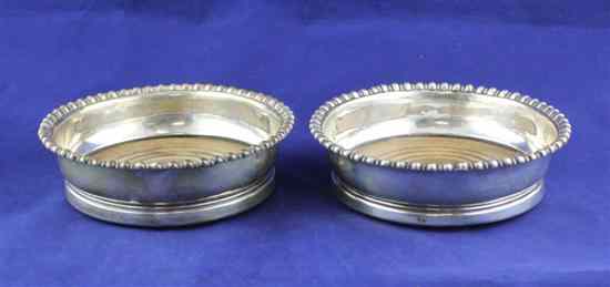 Appraisal: A pair of George III silver coasters of plain circular