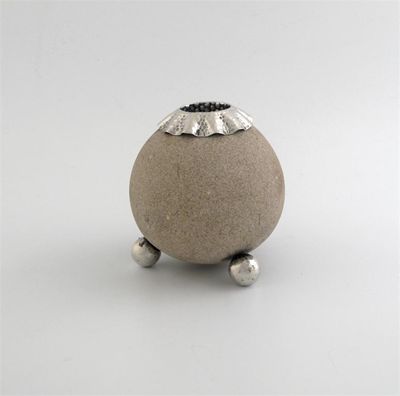 Appraisal: A late Victorian mounted stone match holder striker globular on