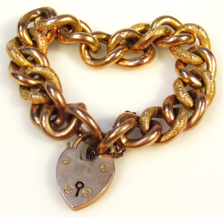 Appraisal: A heavy link hollow bracelet with large two coloured links