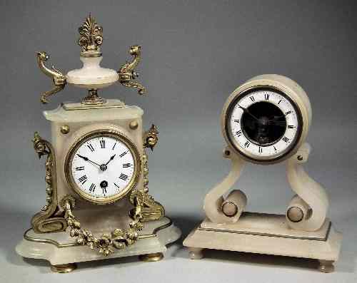 Appraisal: A th Century French gilt brass mounted alabaster mantel timepiece