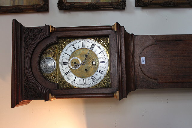 Appraisal: AN EARLY TH CENTURY LONGCASE CLOCK the brass and silvered