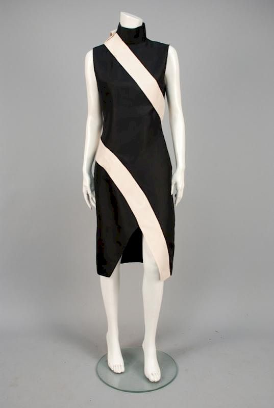 Appraisal: ALEXANDER McQUEEN ASYMMETRICAL SILK DRESS Sleeveless black twill having tall