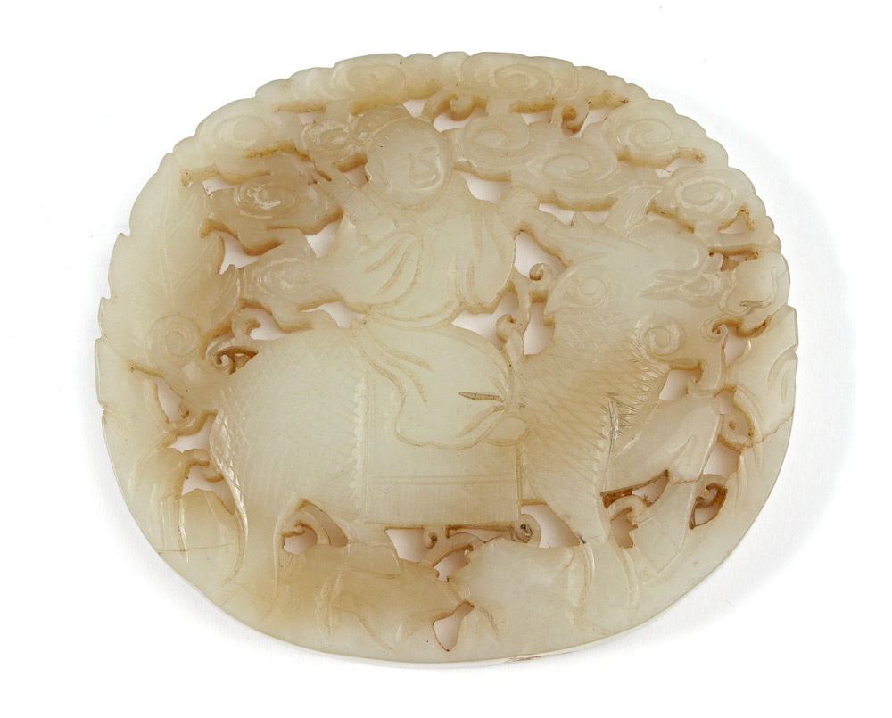 Appraisal: ORIENTAL CARVED JADE MEDALLION Pierce carved with clouds above man