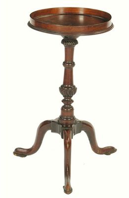 Appraisal: A mahogany kettle stand the circular galleried top on a