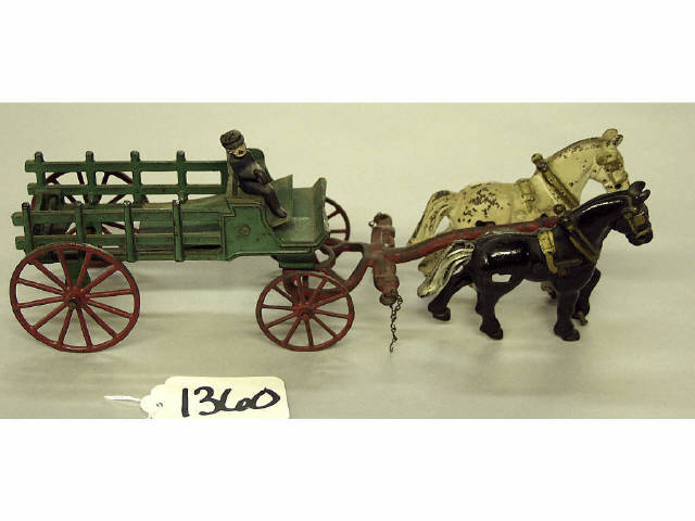 Appraisal: Antique cast iron toy wagon and two horse team with