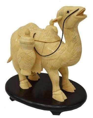 Appraisal: Chinese tiled bone camel figure with saddle reins and lidded