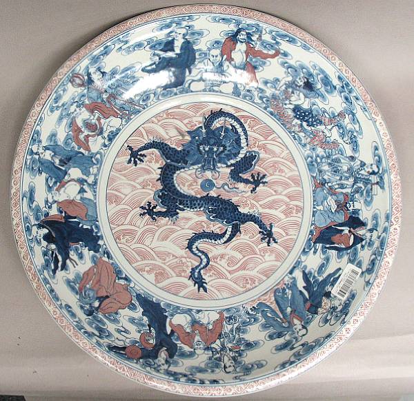 Appraisal: A massive underglaze blue and copper-red decorated porcelain charger Decorated