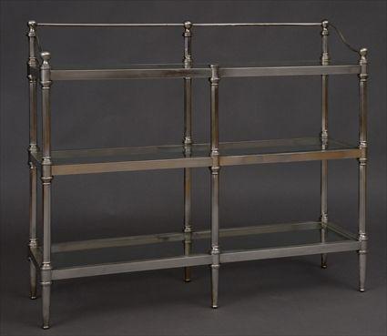 Appraisal: TH C POLISHED STEEL THREE-TIER TAG RE The glass-paneled galleried