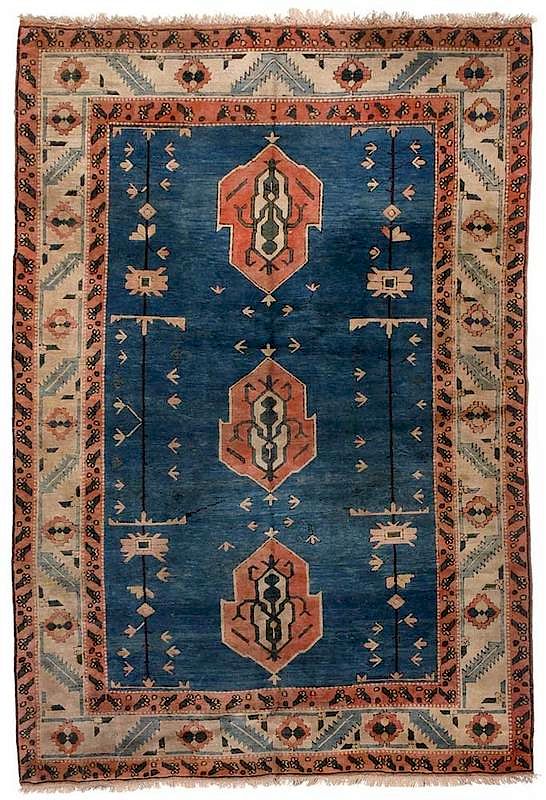 Appraisal: Turkish Carpet blue field with three leaf designed central medallions