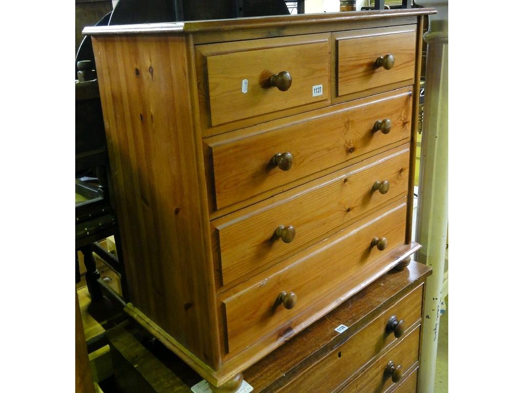 Appraisal: A modern stripped pine chest fitted with three long and