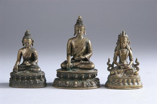 Appraisal: THREE TIBETAN BRONZE DEITIES th century Two figures of Buddha