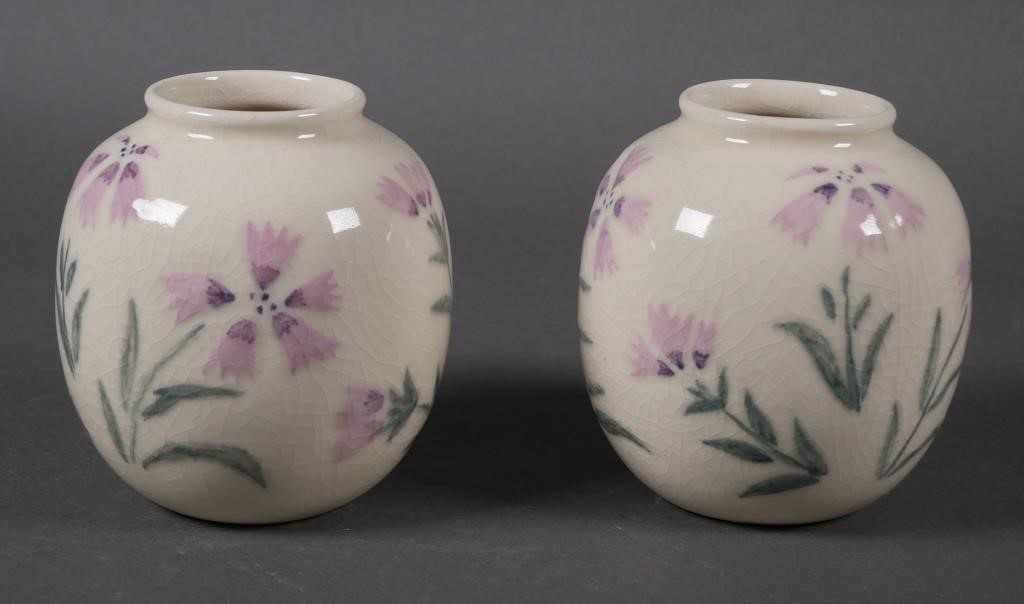 Appraisal: Pair Rookwood Pottery vases with floral motif on cream ground