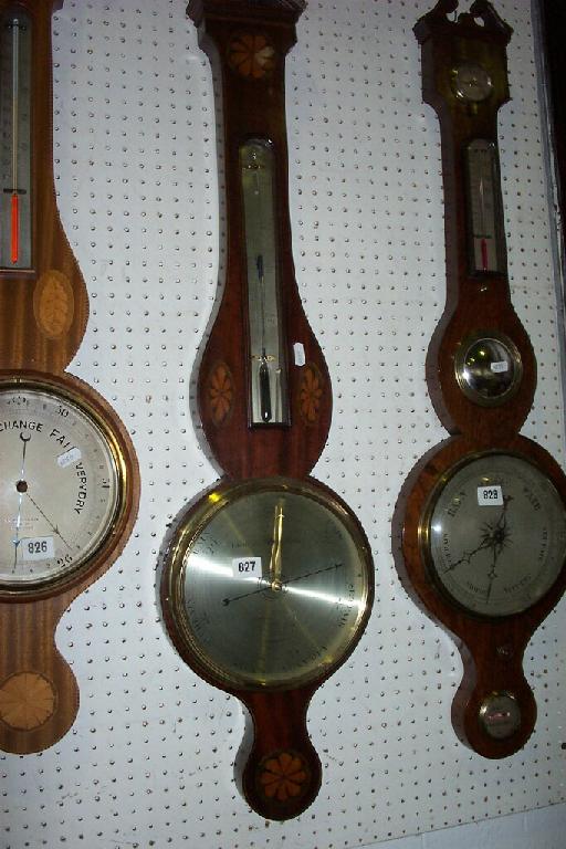 Appraisal: A Georgian mahogany wheel barometer with inlaid string borders and