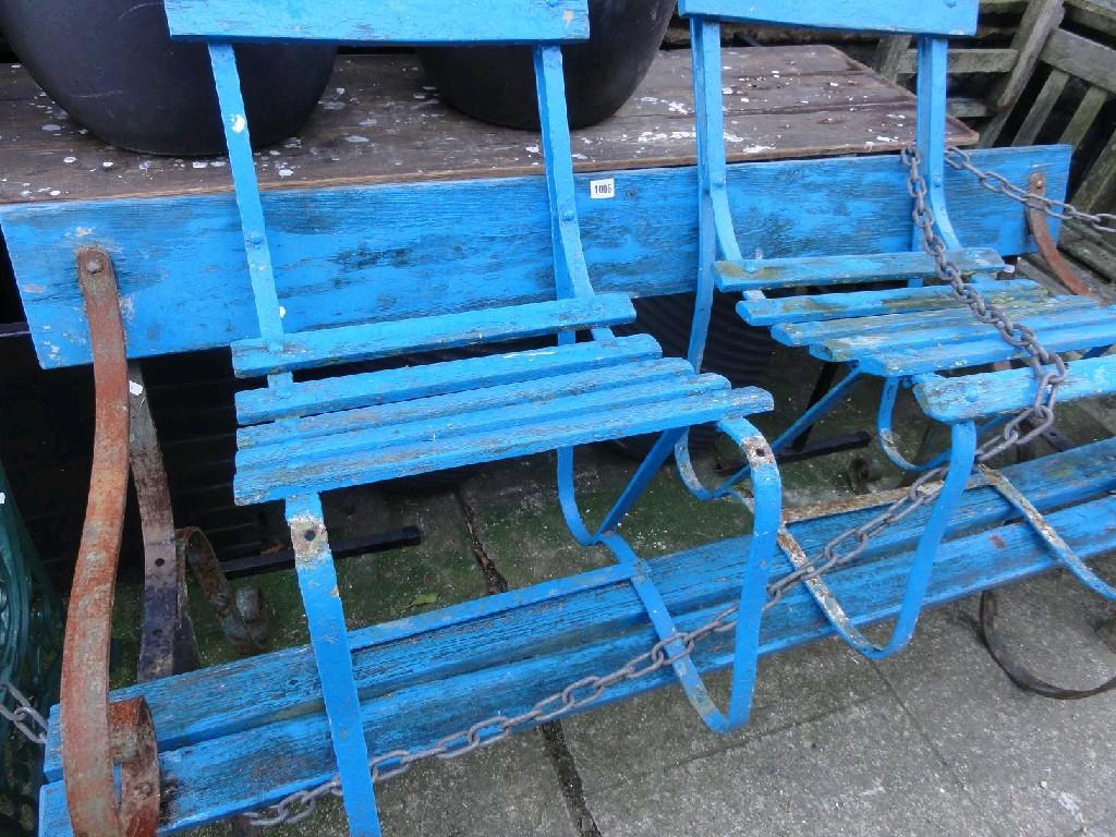 Appraisal: A sprung steel garden bench with painted slatted seat and