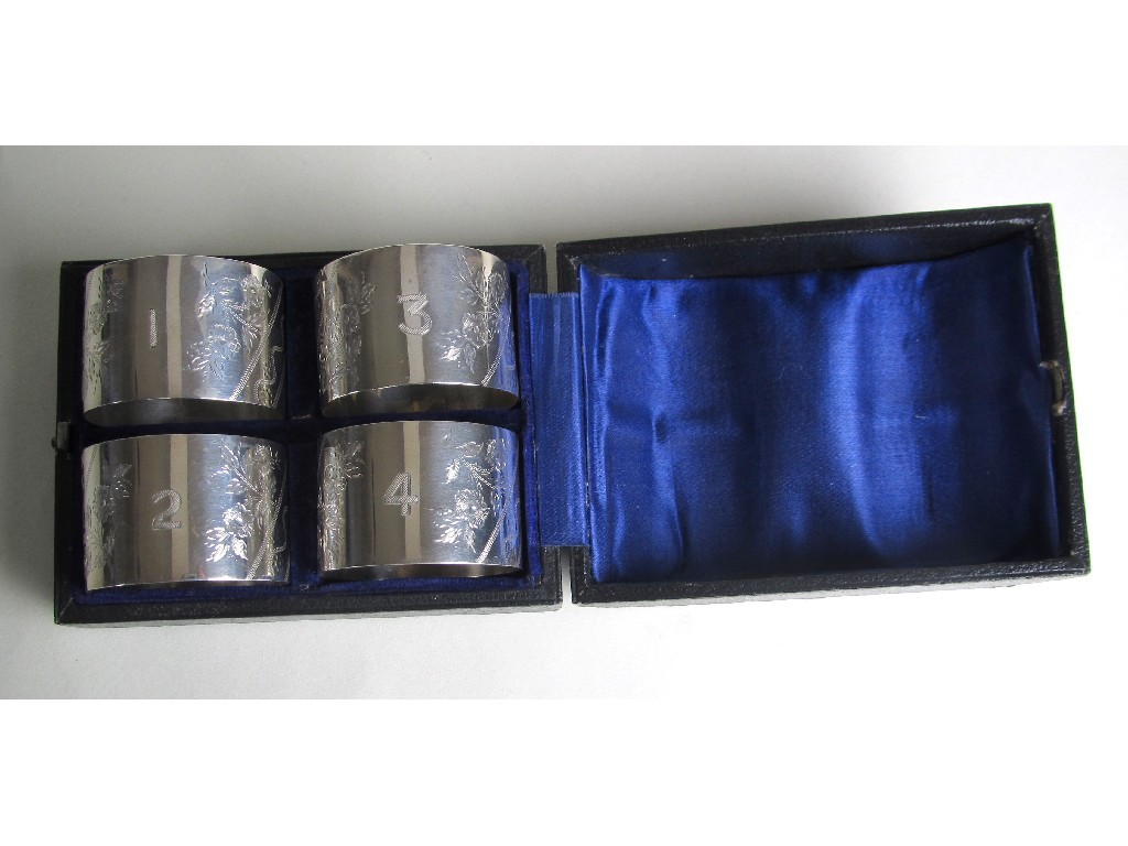 Appraisal: A set of four Edwardian silver napkin rings engraved with