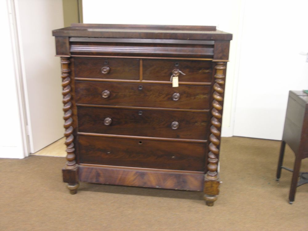 Appraisal: A Victorian flamed veneered mahogany chest of drawers ovolo shape