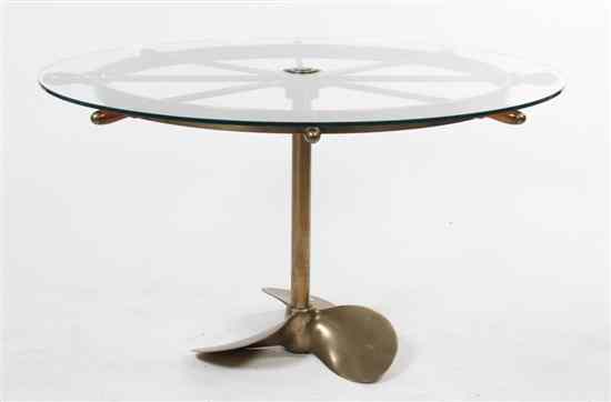 Appraisal: A Brass Ship Wheel Kitchen Table having a glass top