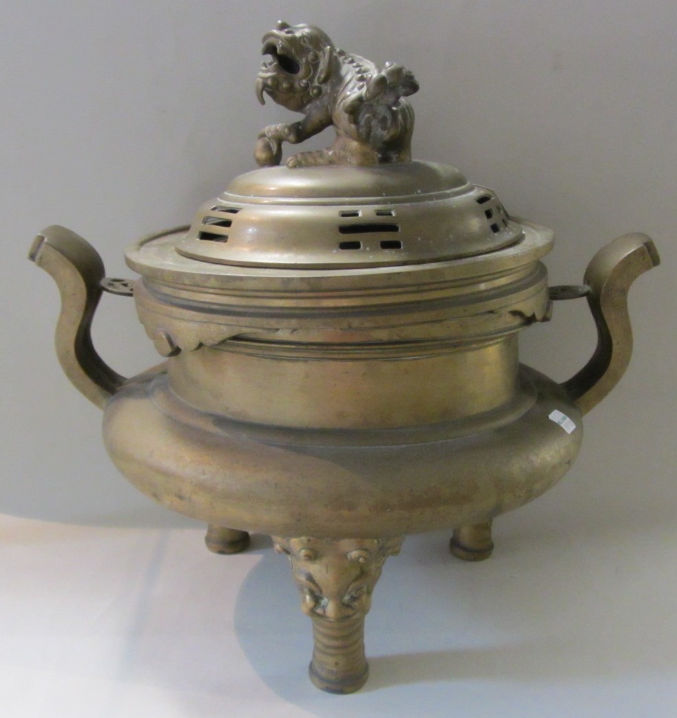 Appraisal: A large Chinese bronze censer cover and stand circa with