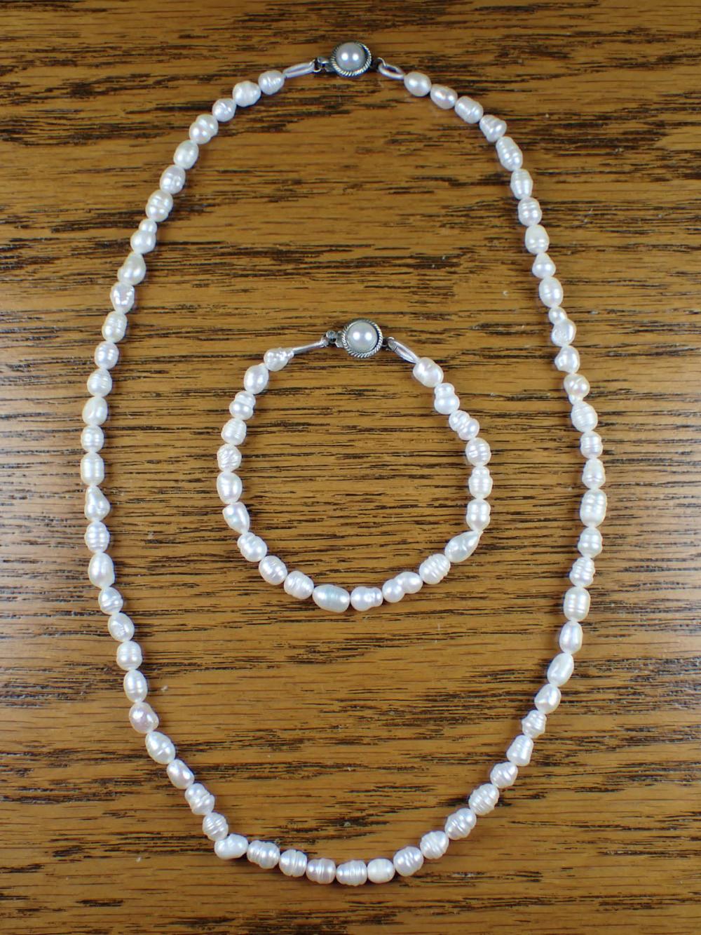 Appraisal: BAROQUE WHITE PEARL NECKLACE AND BRACELET SET including a -