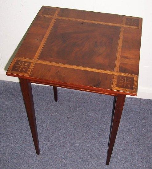 Appraisal: A mahogany and inlaid table the square top with geometric