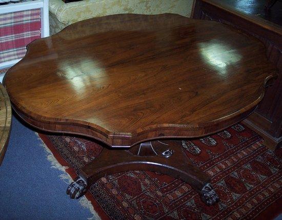 Appraisal: A late Regency rosewood shaped oval breakfast table the top