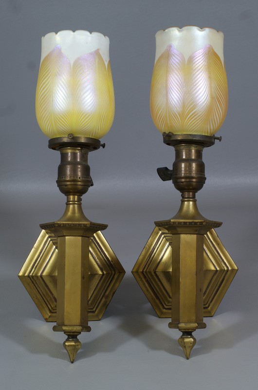 Appraisal: Pr brass wall sconces with pulled feather Quezal shades one