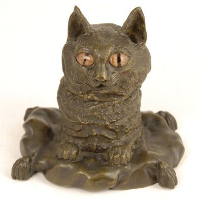 Appraisal: A bronze novelty inkwell modelled as a cat on a