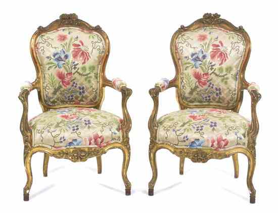 Appraisal: A Pair of Continental Giltwood Fauteuils each having a foliate