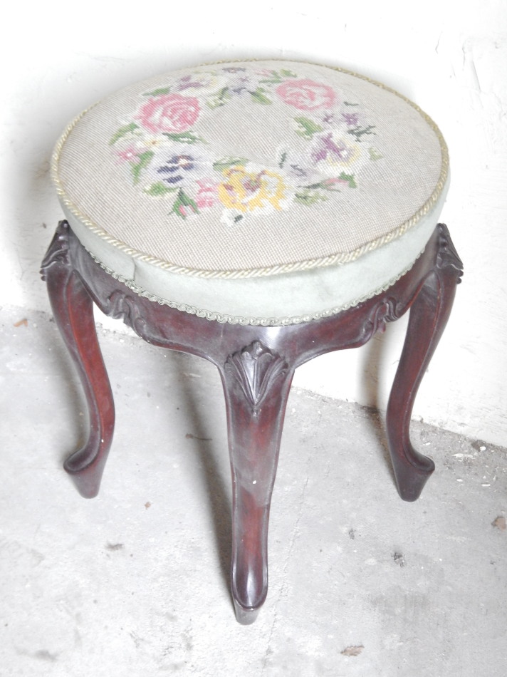 Appraisal: A Victorian style mahogany stool with circular floral woolwork seat