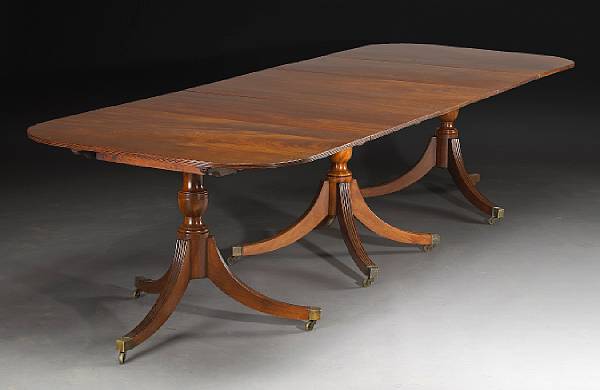 Appraisal: A Regency mahogany three pedestal dining table partially composed of