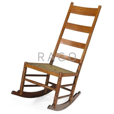 Appraisal: COUNTRY FURNITURE Ladder-back rocker Tiger maple rush and iron Unmarked