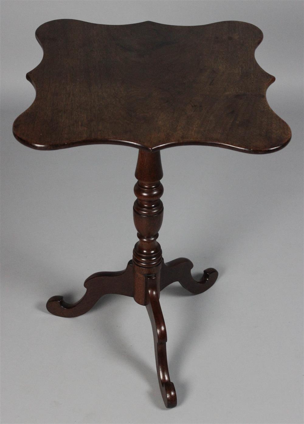 Appraisal: MAHOGANY TEA TABLE WITH SHAPED TOP AND LEGS the rectangular