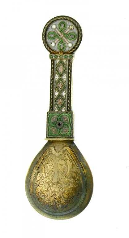 Appraisal: A NORWEGIAN SILVER GILT AND TRANSLUCENT ENAMEL REVIVALIST SPOON decorated