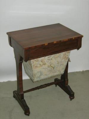 Appraisal: A ROSEWOOD WORK TABLE of oblong form with part fitted