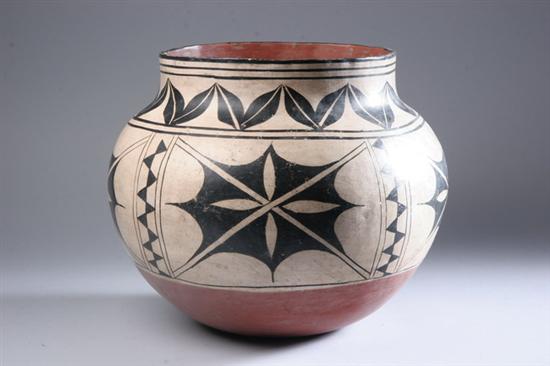 Appraisal: SANTA DOMINGO BLACK AND WHITE POTTERY VESSEL Flower-head decoration -