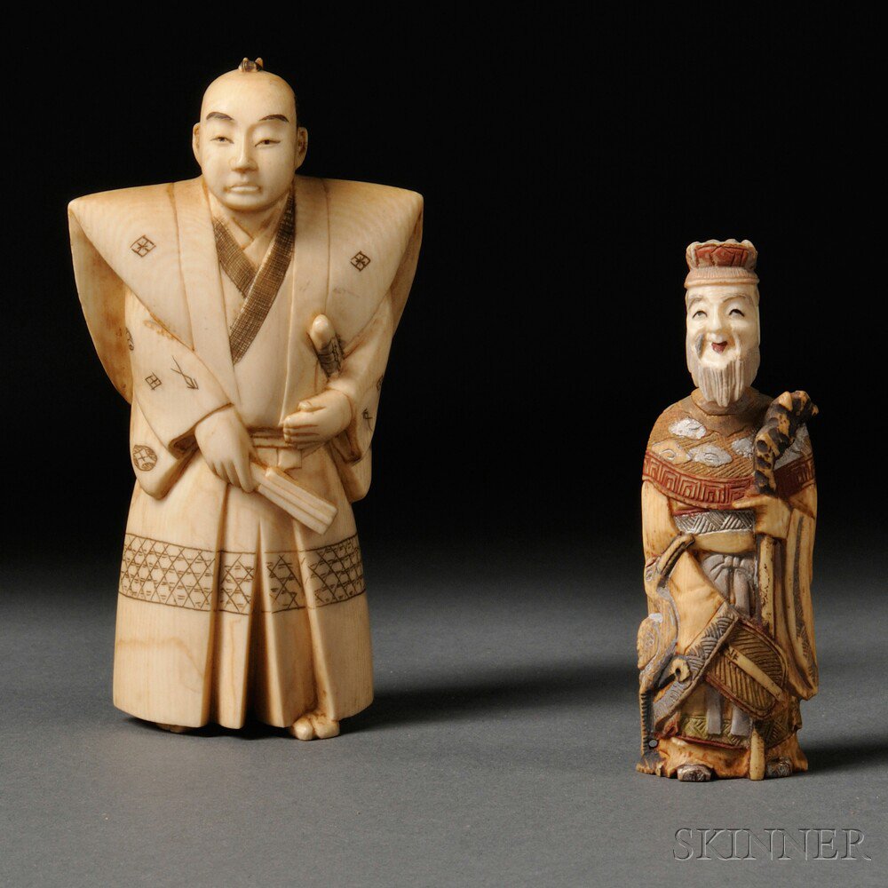 Appraisal: Two Ivory Carvings Japan th century a polychrome snuff bottle