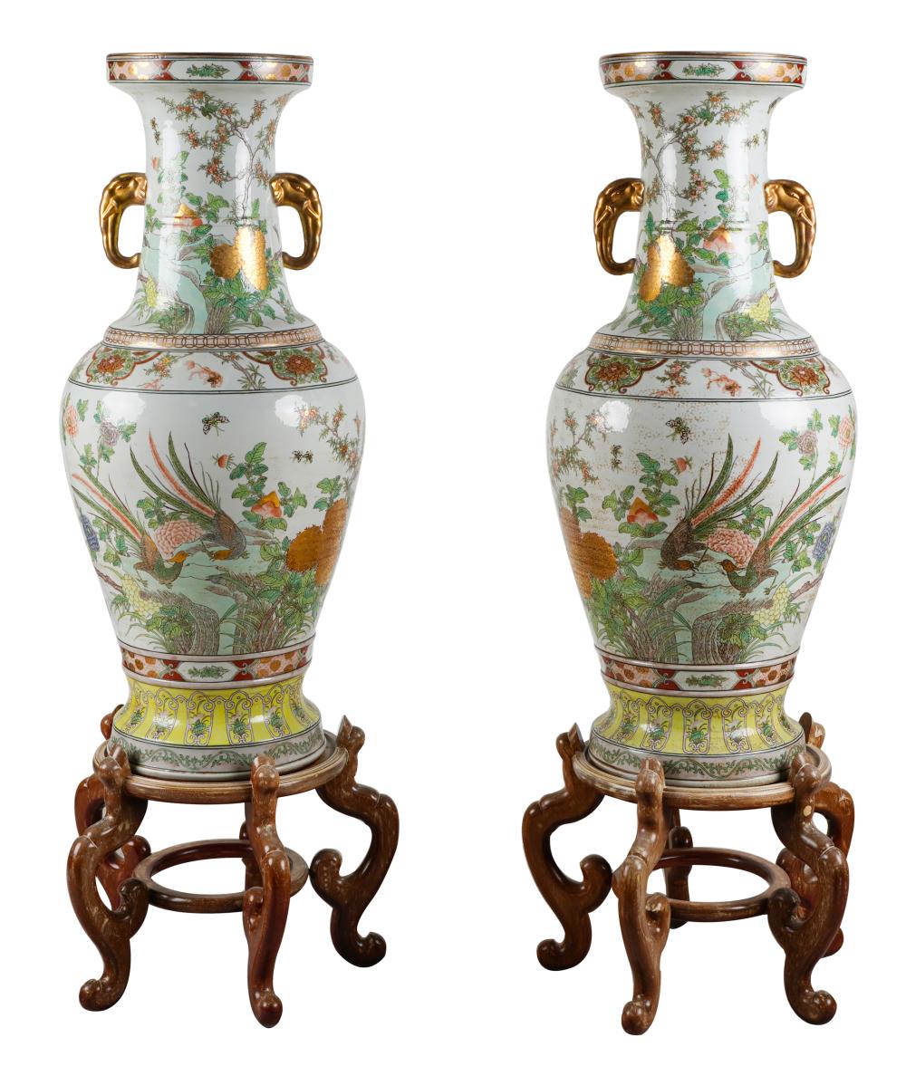 Appraisal: PAIR OF LARGE JAPANESE PORCELAIN VASESon wooden stands inches diameter