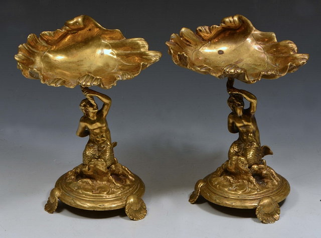 Appraisal: A PAIR OF ITALIANATE GILT BRASS TAZZAS of scallop shell