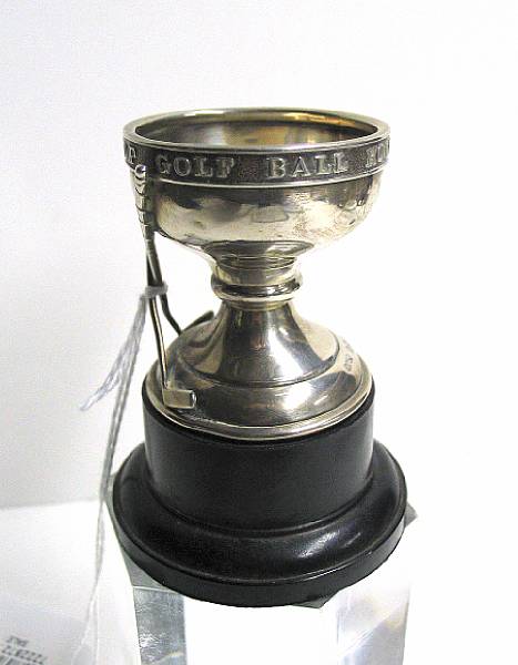 Appraisal: A Dunlop Hole in One silver trophy on a Bakelite