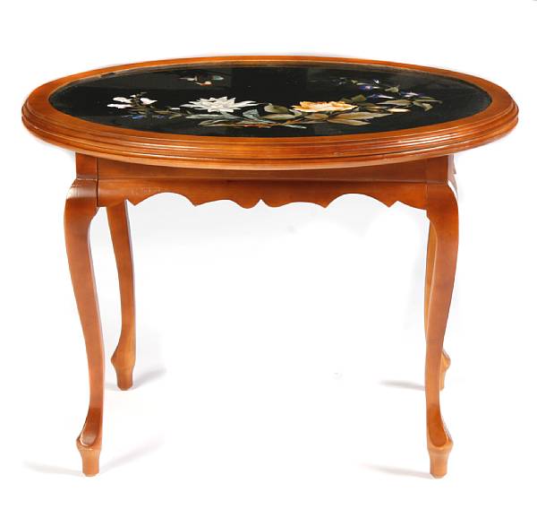 Appraisal: An Italian pietra dura floral design table top mounted in