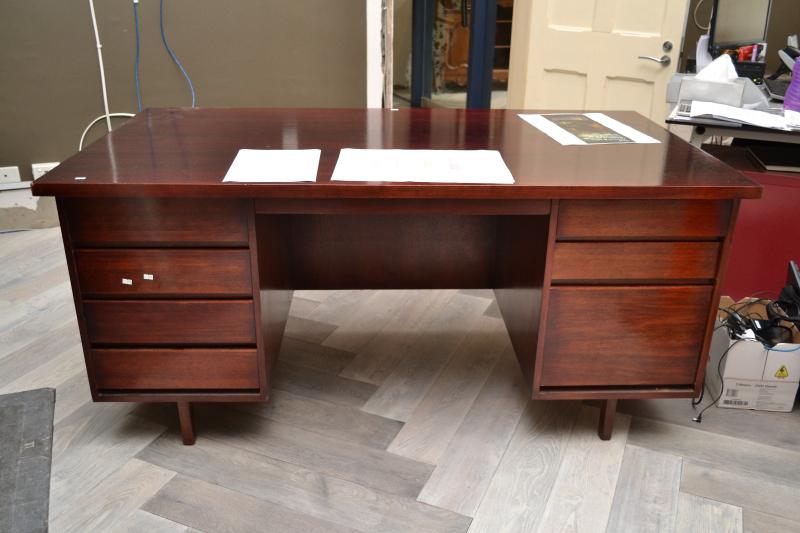 Appraisal: A MIDCENTURY DESK WITH SEVEN DRAWERS A MIDCENTURY DESK WITH