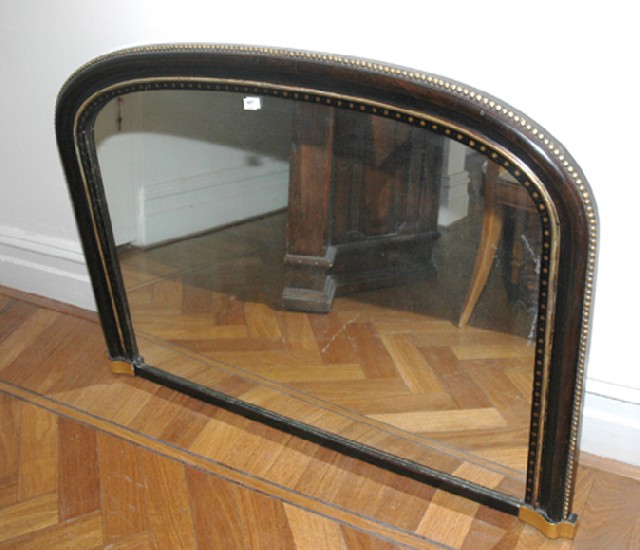 Appraisal: A VICTORIAN EBONISED AND GILT OVER MANTEL MIRROR The rounded