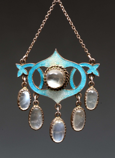 Appraisal: An Arts Crafts enamel and moonstone pendant with central moonstone