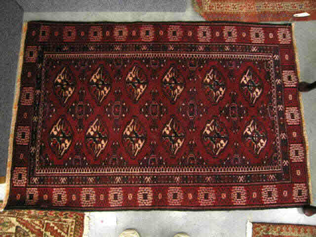 Appraisal: Turkman Persian Handmade Rug indigio ivory geometrics on deep red