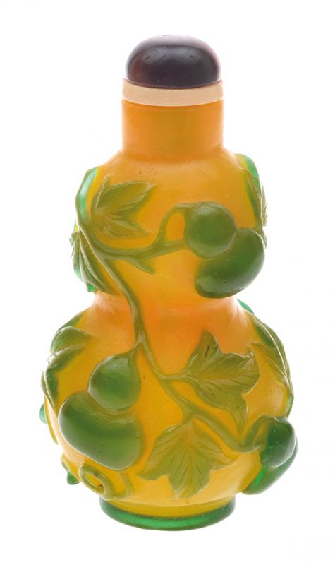 Appraisal: A GREEN OVERLAY ON YELLOW GLASS SNUFF BOTTLE WITH HAWKSEYE