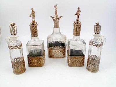 Appraisal: A pair of mounted glass liqueur decanters and figural stoppers